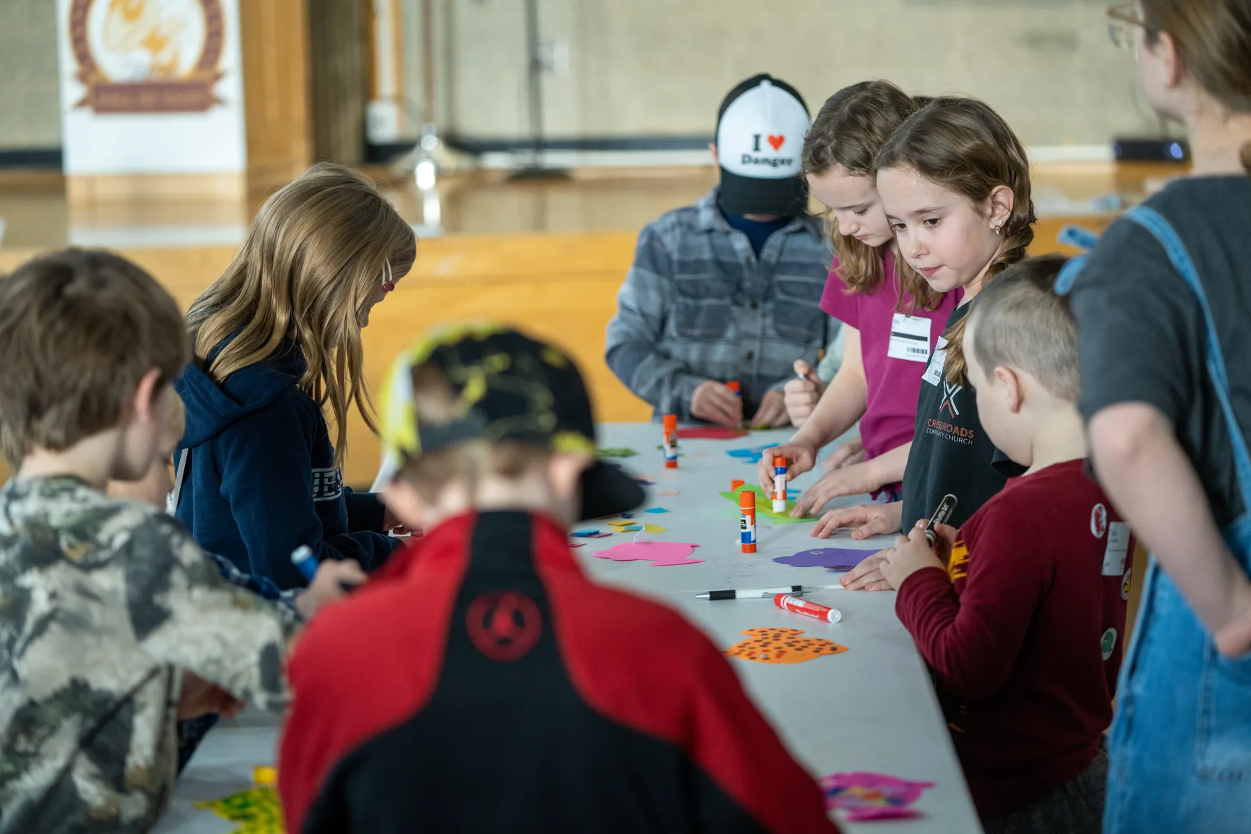 Children engaged in craft activities during Crossroads Kids at Crossroads Community Church